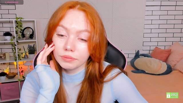 Honeyautumn redhead teen touches face in sheer top Chaturbate