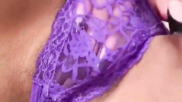 Hot brunette licks fingers after pussy masturbation in purple lace lingerie