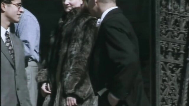 Bella Blond in fur coat with suited men - La Sposa Bride 1995