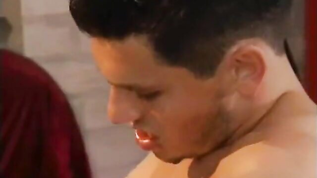 Closeup of young man's aroused face and bare neck in explicit gay video thumbnail