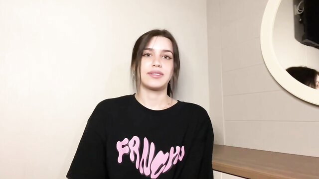 Eva Black in Fruncho tee, smiling brunette beauty