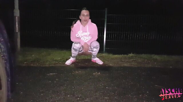 Busty German MILF squatting in pink hoodie and leggings after night jog