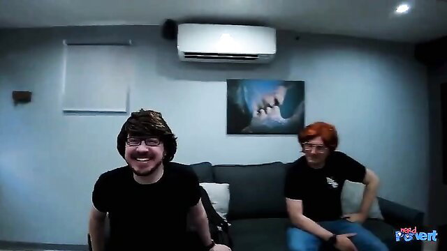 Two grinning guys on couch in Double Cock Whore threesome preview