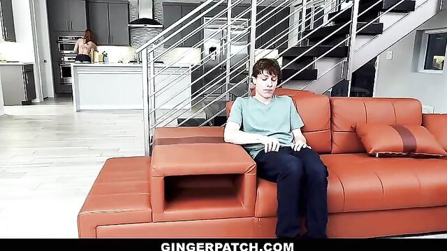 Redhead ginger teen boy sits on couch in GingerPatch adult video