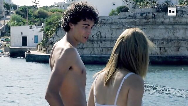 Violante Placido topless with sexy guy by sea in Fino all'ultimo battito