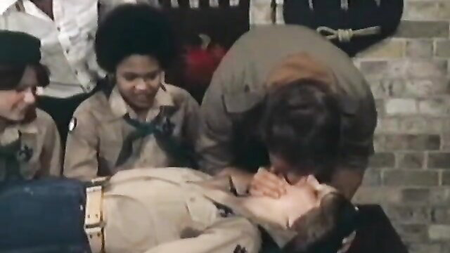Vintage teen orgy scene: black girls in uniforms giving CPR mouth-to-mouth to man