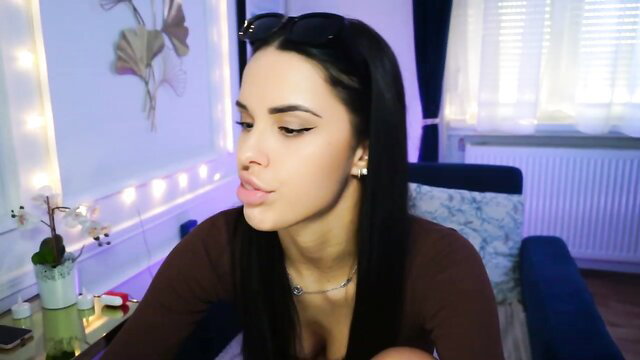 Cinnabellee teases with plump lips, huge tits in tight top, seductive gaze