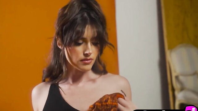 Alluring Keep Chambers in black one-shoulder top, bangs, sultry gaze