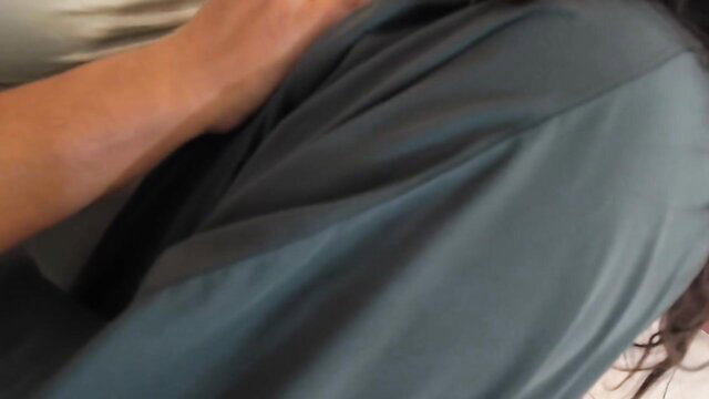 Mira Halabi in gray dress, arm extended in cuckold spy scene