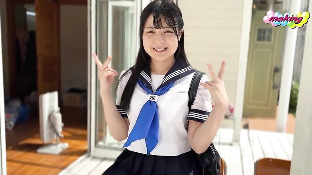 Cute Japanese JAV idol Komatsu M in sexy sailor schoolgirl uniform, peace signs