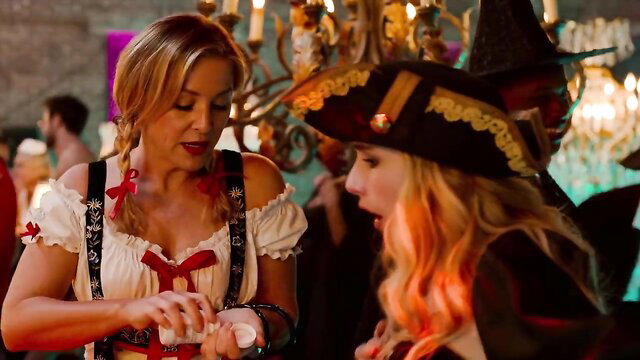 Kristin Chenoweth in Bavarian dress chats with Emma Roberts pirate costume Holidate hot scene