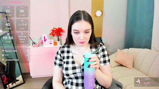 _shy_jenny_ chaturbate camgirl sipping drink in checkered top, big boobs tease