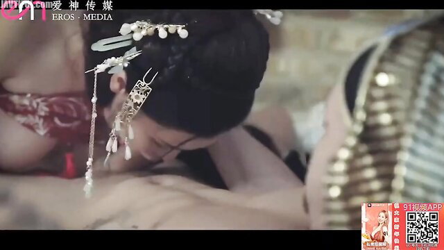 Asian beauty in ornate ancient Chinese gown and jewelry in erotic scene