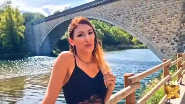 Stella Love redhead MILF by scenic bridge in sexy black top