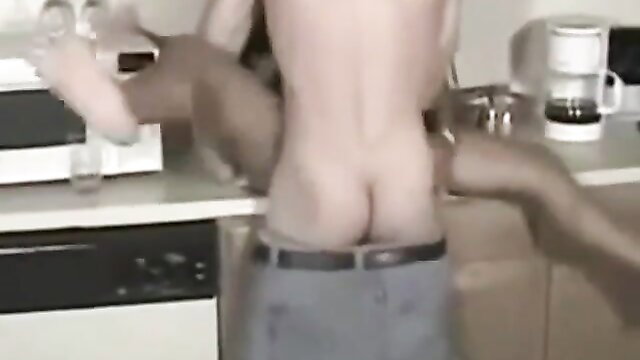 Shirtless white twink bent over kitchen counter, black hands groping bare ass