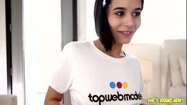 Petite Latina Mae White smiling in Top Web Model tee, brand new