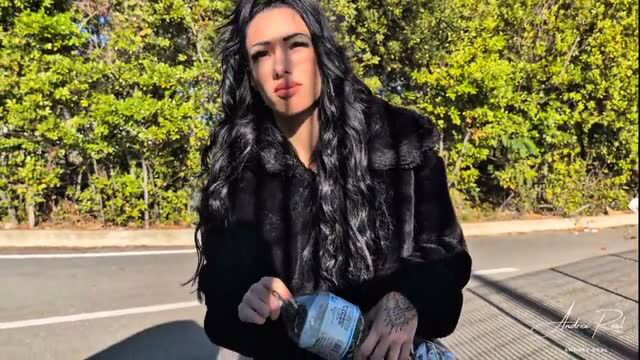 Hot Latina Andra R. in fur jacket holding bottle roadside tease