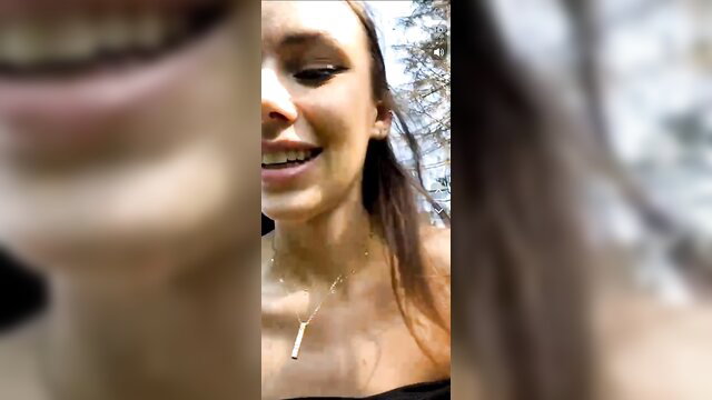 Smiling teen with braces flashes tits outdoors in forest