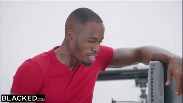 Jax Slayher in red shirt, muscular Black male model from adult video