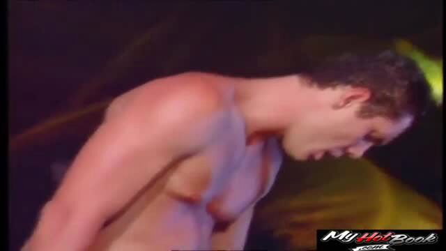 Silvia Saint shirtless and sweaty in low light adult scene
