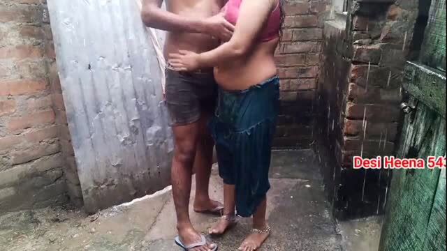 Desi auntie in wet saree getting intimate in the rain
