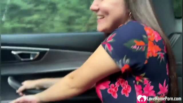 Smiling woman in floral top driving car, amateur homemade adult video