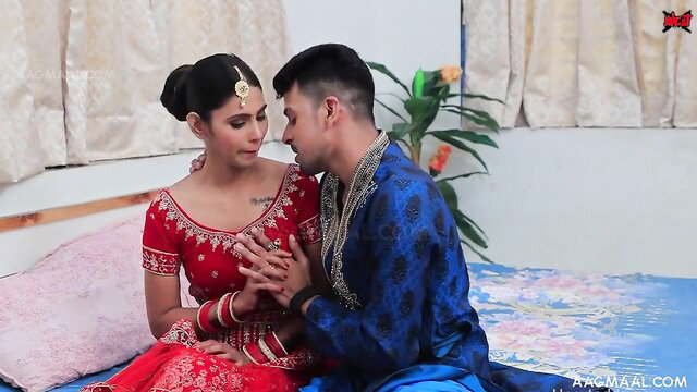 Indian bride in red saree fondles groom on first night bed