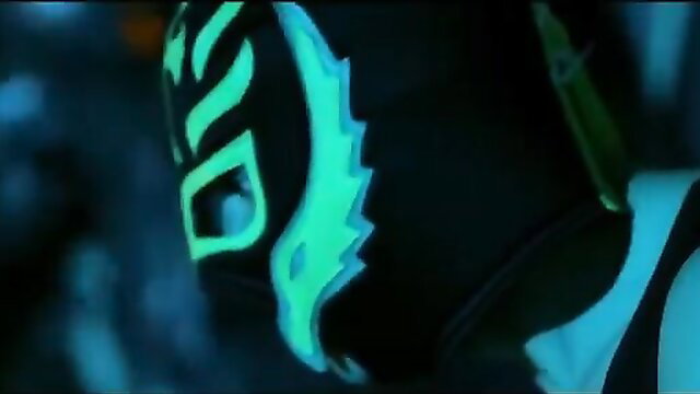 Alexandra Stan in glowing neon lucha libre mask closeup