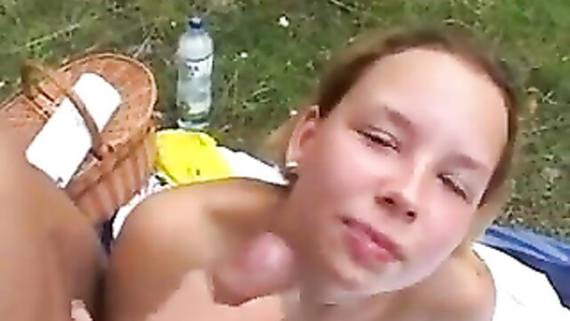 Teen blonde outdoor blowjob closeup with penis to lips on picnic