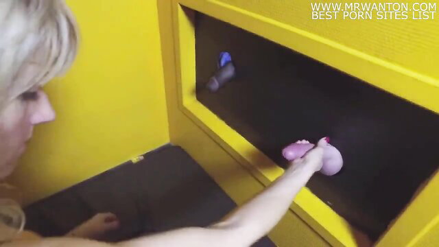 Naomi sexy French MILF grabs cock through gloryhole wall