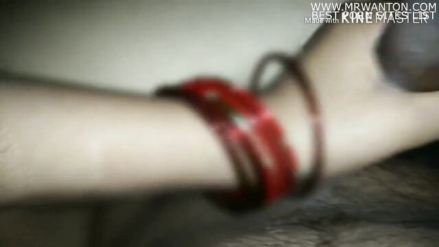 Closeup of Indian girl's arm with red bangles in sex video