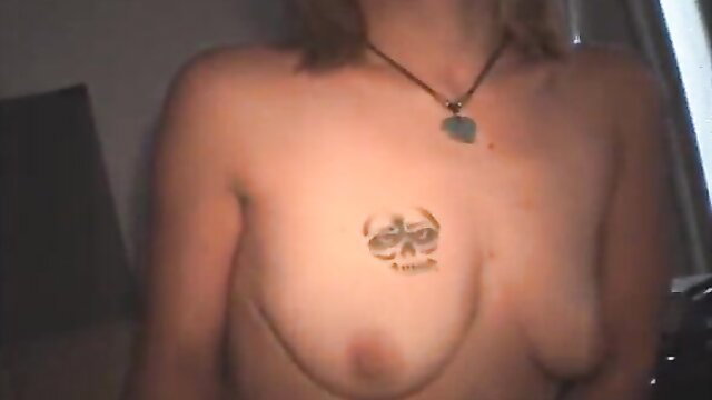 Topless white crack whore with skull chest tattoo bares small tits