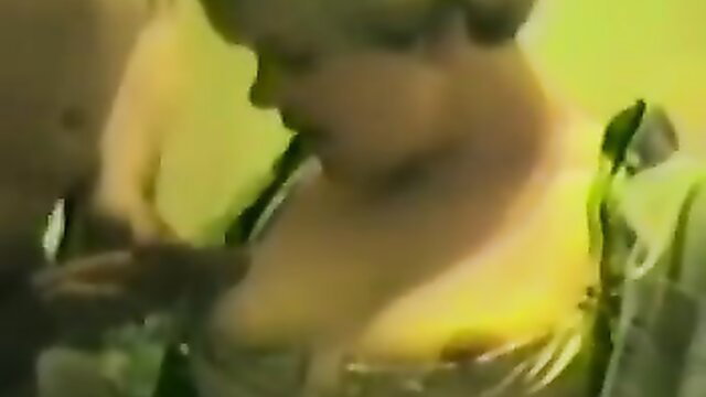 Cynthia flashing her big tits in green dress closeup