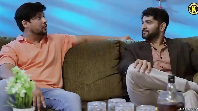 Two hot Indian guys chilling on couch with drinks