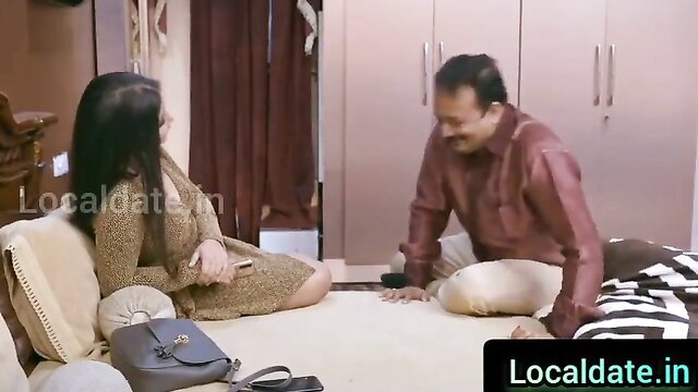 Indian MILF in tight dress sits with horny father-in-law on bed