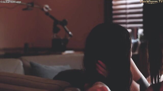 Daisy half-Korean babe rear view on couch in dim room