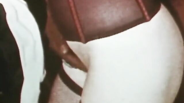 Black hand stuffs huge cock into woman's hairy pussy in vintage porn