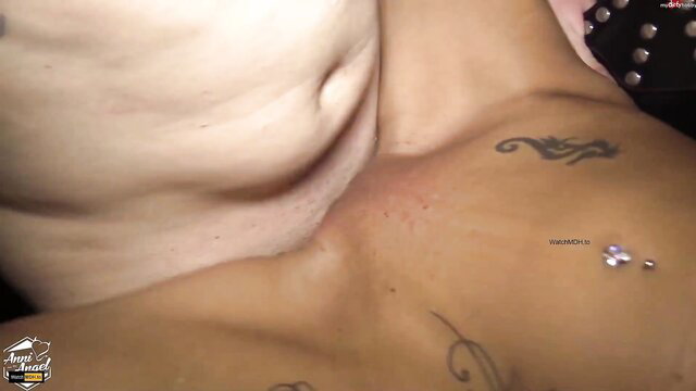 Anni Angel's tattooed tits and navel piercing up close in wild threesome
