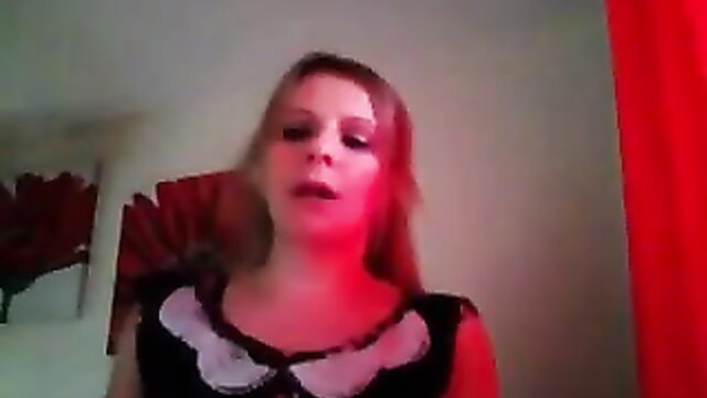 Blonde one-boob mastectomy woman in sexy black dress, seductive expression