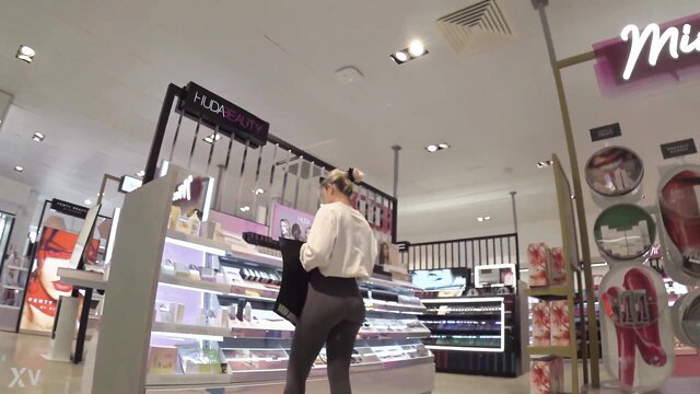 Creepshot of blonde big ass girl in tight leggings at H&M store