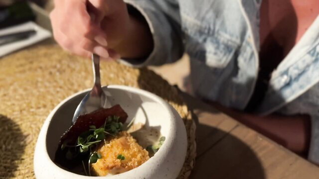 Pam eating gourmet dish outdoors in sexy denim jacket, Jacquie Et Michel TV vlog