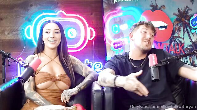 Tattooed Asian slut with brunette hair on podcast with midget man