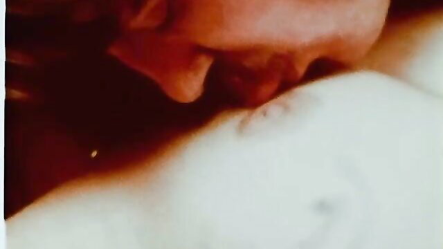 Vintage Moon Films closeup of woman kissing man's erect cock sensually
