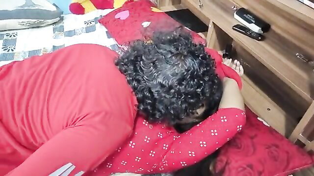 Curly-haired Indian wife in red dress spoons with man, sexy rear tease