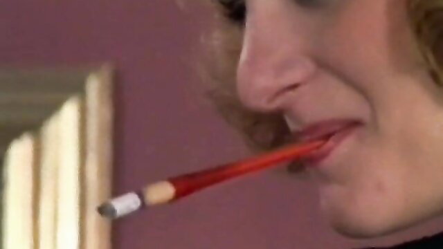 Retro blonde smokes red cigarette closeup lips, hot lingerie tease