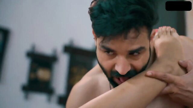 Indian man passionately kissing woman's foot in raunchy coquette sex scene