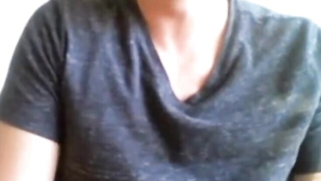 a person wearing a dark v-neck t-shirt