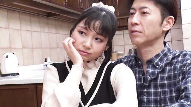 Satomi Inoue in schoolgirl vest with man in kitchen JAV scene