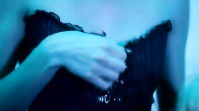 Roberta Gemma adjusting black lace corset, nude tits in Hyde's Secret Nightmare