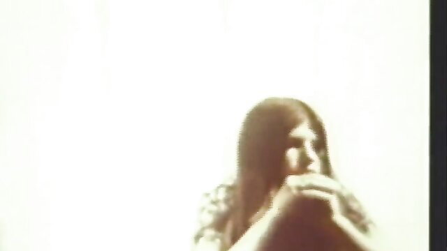Vintage 1962 porn thumbnail of long-haired brunette groupie in softcore pose